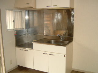 Kitchen. There is a ventilation window kitchen