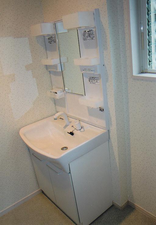 Wash basin, toilet. Spacious wash room of the space