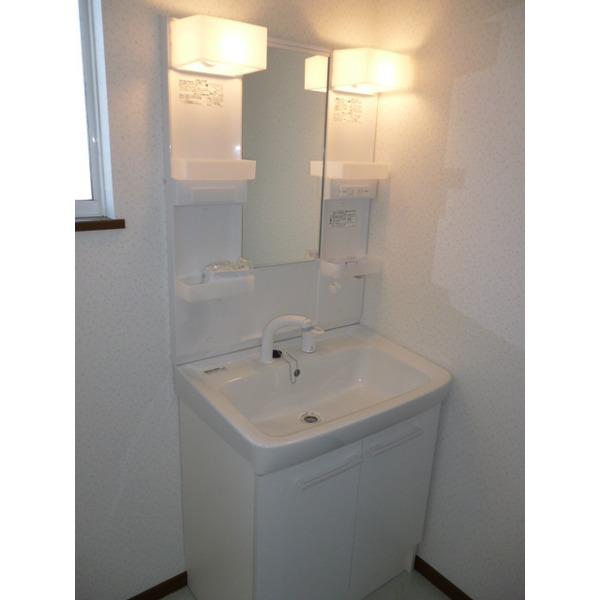 Wash basin, toilet. "Clean wash room"
