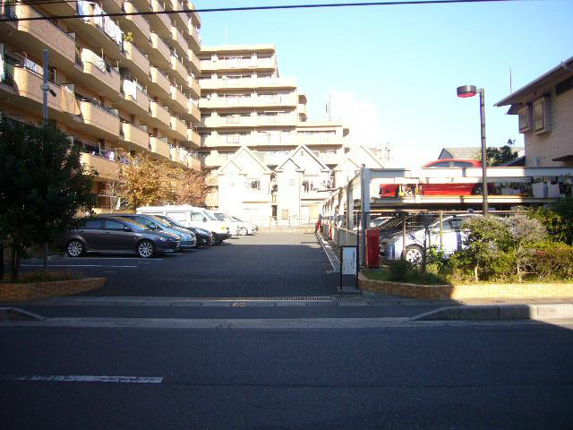 Parking lot. On-site parking is flat and a mechanical type.