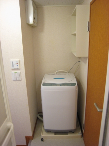 Other Equipment. There is a washing machine in a room! 