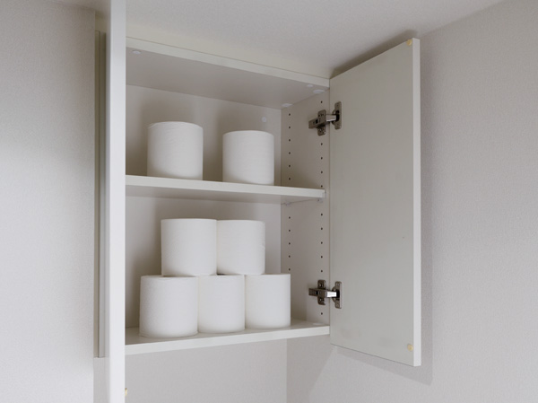 Bathing-wash room.  [Toilet top shelf cupboard] Secure a space that can accommodate the sanitary supplies to the toilet. Hanging cupboard Show us To spacious clean the space.