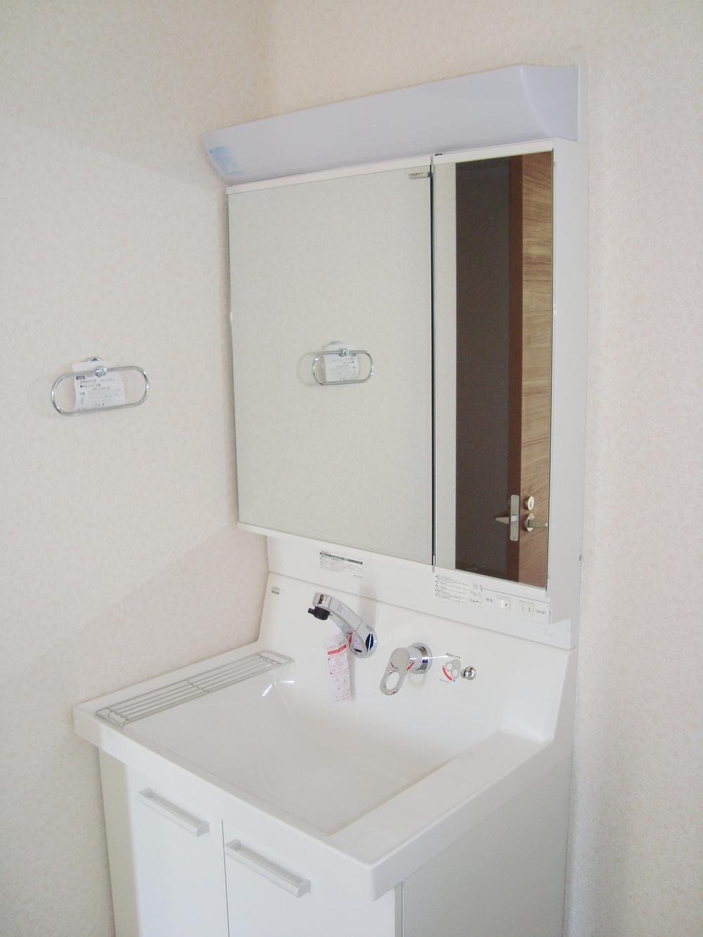 Wash basin, toilet. With convenient hand shower to wash basin of wide sink