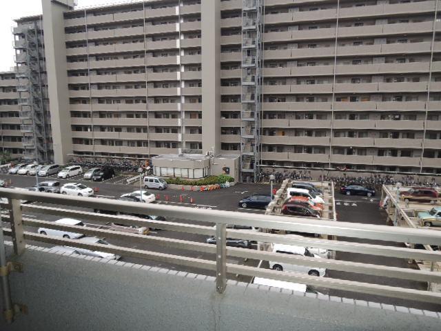 Balcony. Also sunny because it is a parking lot in front of