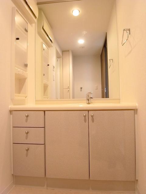 Wash basin, toilet. Wide - vanity mirror