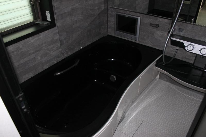 Bathroom. Bathroom with TV, It is shallow spacious tub of straddling.