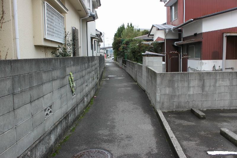 Local land photo. It is a photograph of the south side of a farm road. When passing through this road, It is about a 1-minute walk from the Matsuyama Coop Saiin shop.