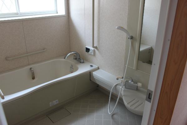 Bathroom. It is bright and spacious bathroom with a window