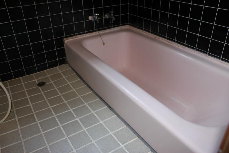Bathroom. Shallow spacious bathtub of straddling