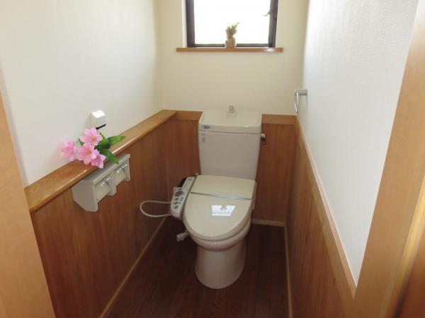 Toilet. There is a small counter, Convenient.