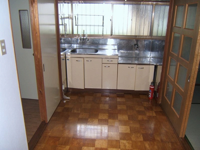 Kitchen. I think that is also good to use widely by connecting with neighboring Japanese-style room and remove the door.