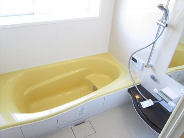 Bathroom. Yellow tub is fashionable
