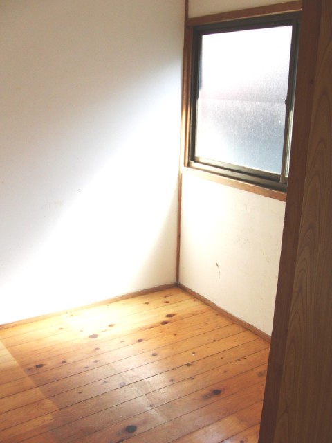 Other room space. It is a photograph of the closet. 