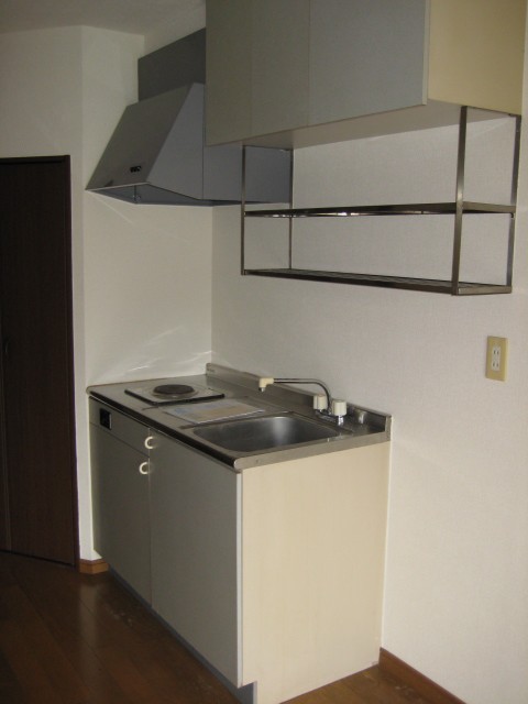 Kitchen. There is one-burner stove and a mini-refrigerator