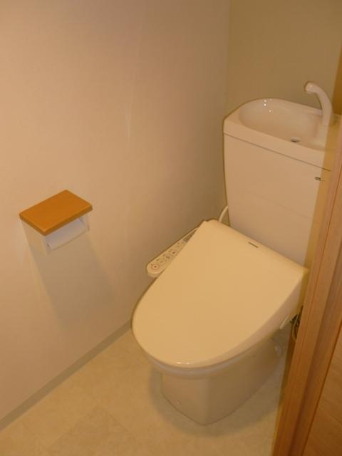 Toilet. Warm water cleaning toilet seat is a new article