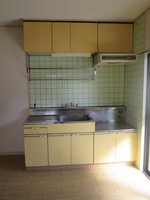 Kitchen. There is a window is bright kitchen. 