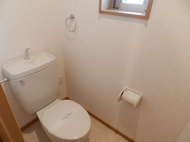 Toilet. With a window to the toilet. 