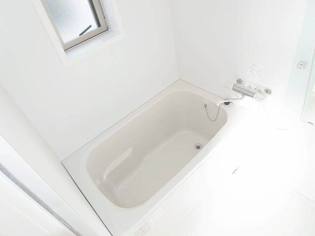 Bath. There is a window in the wide tub!