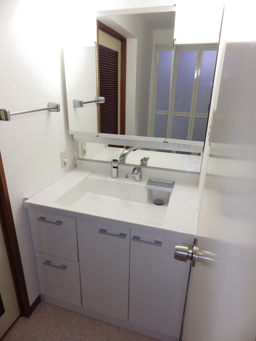 Wash basin, toilet. Vanity of bright large mirror