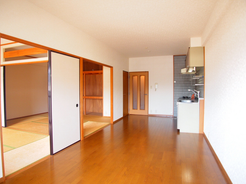 Living and room. It is calm color of flooring.