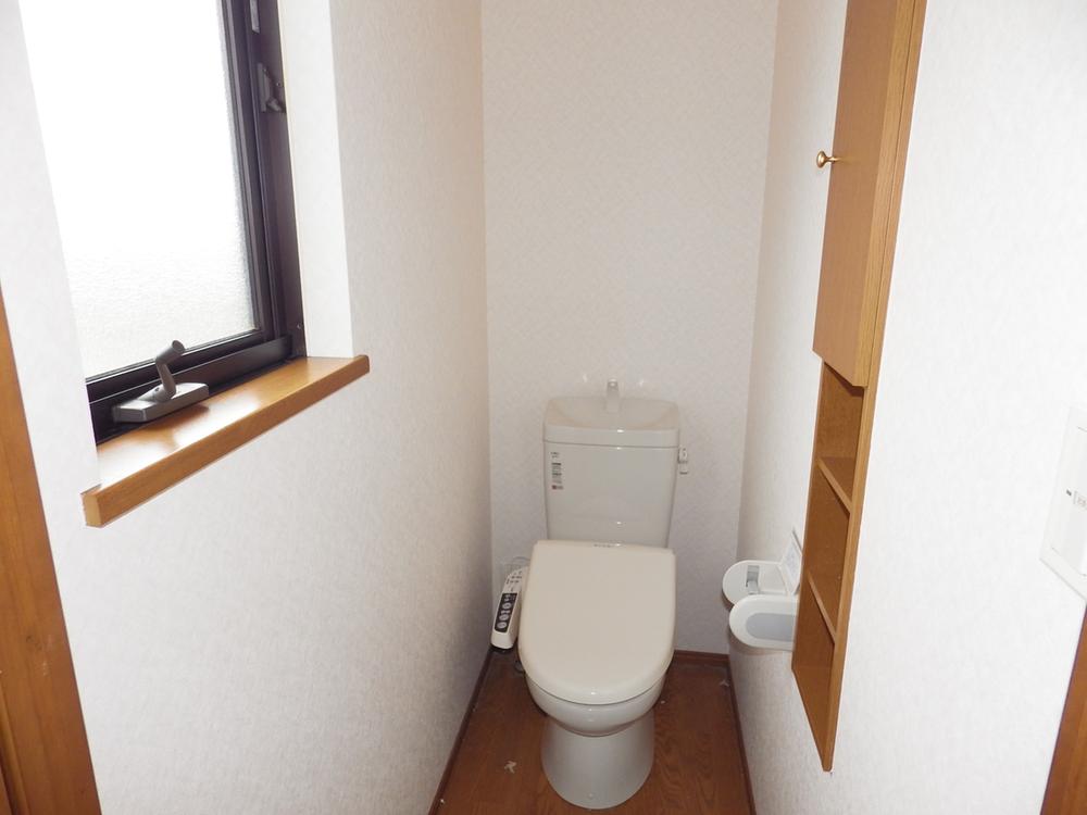 Toilet. There are also bright toilet with a window on the second floor. 
