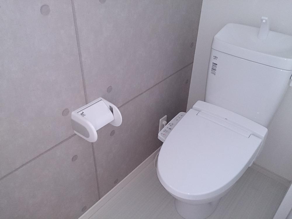 Toilet. Concrete tone wallpaper