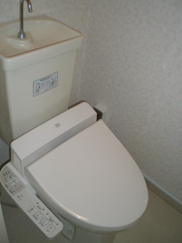 Toilet. It is a warm water washing toilet seat