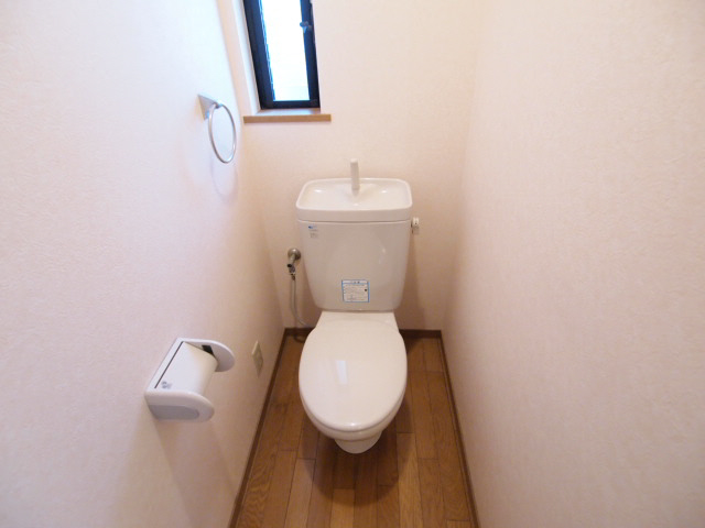 Toilet. Also rising window to the toilet