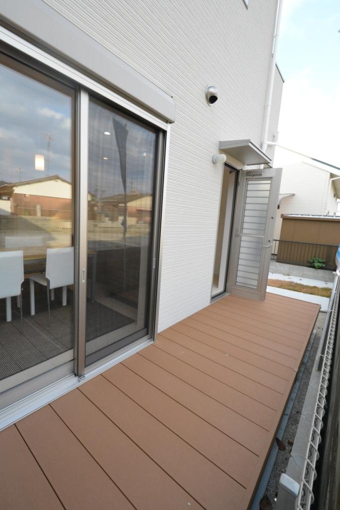 Other. It is a wood deck of the kitchen side.
