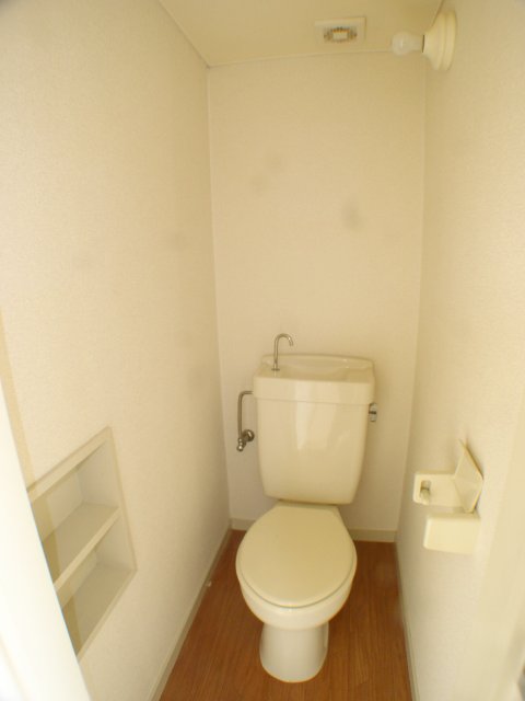 Toilet. 101 is a photograph of the room in Room.