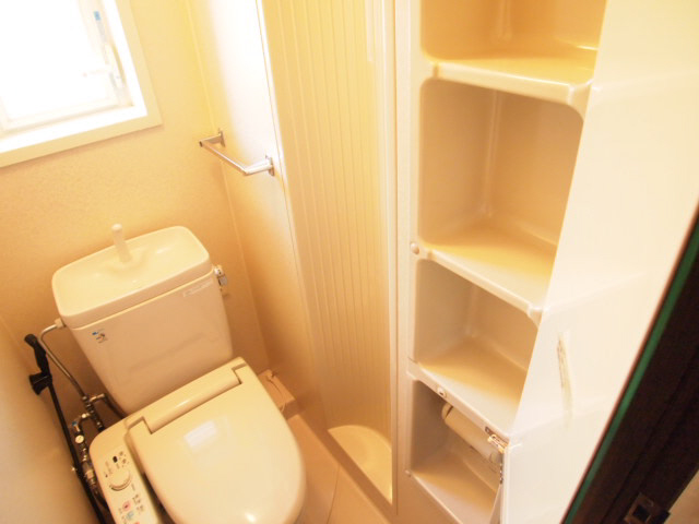 Toilet. Spacious storage rooms to the toilet. 
