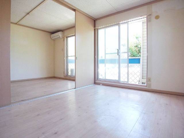 Living and room. Transformed into a large living room with fully open the sliding door