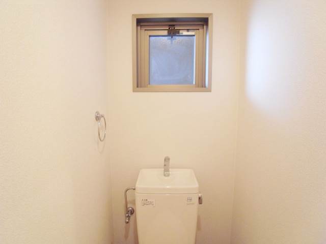 Toilet. There is a ventilation window