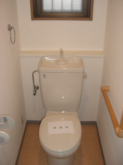 Toilet. With a window to the toilet