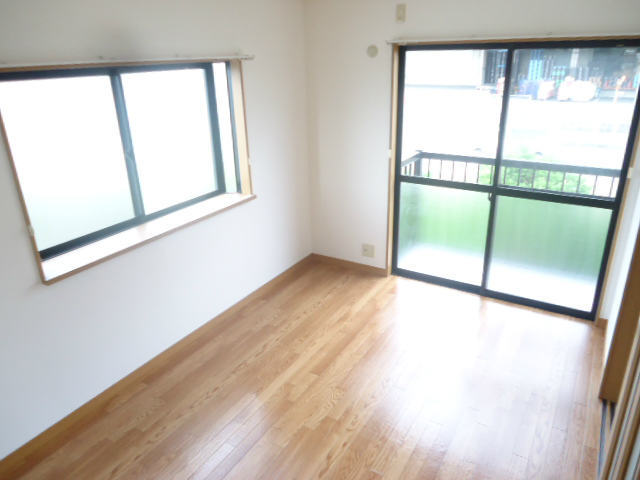Living and room. There is a window, Bright Western-style