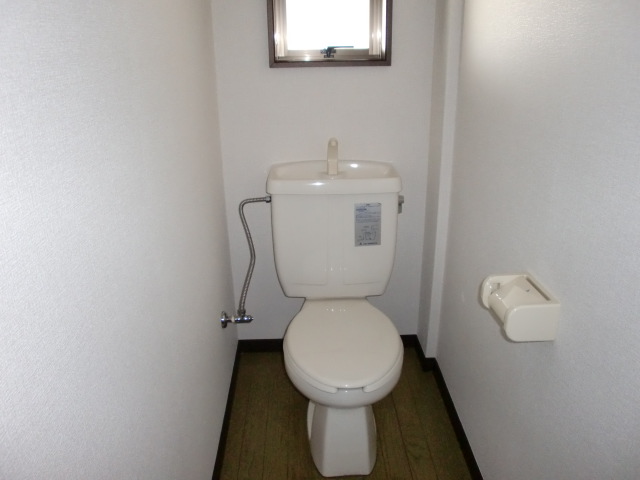 Toilet. It has a window in the toilet