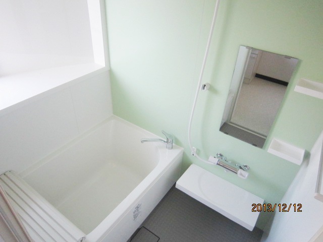Bath. Bright bathroom with a window. There is also a large mirror. There add-fired function