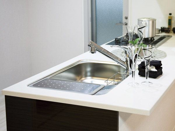 Kitchen.  [Kitchen counter] One top finish floating luxury, Beauty is different.