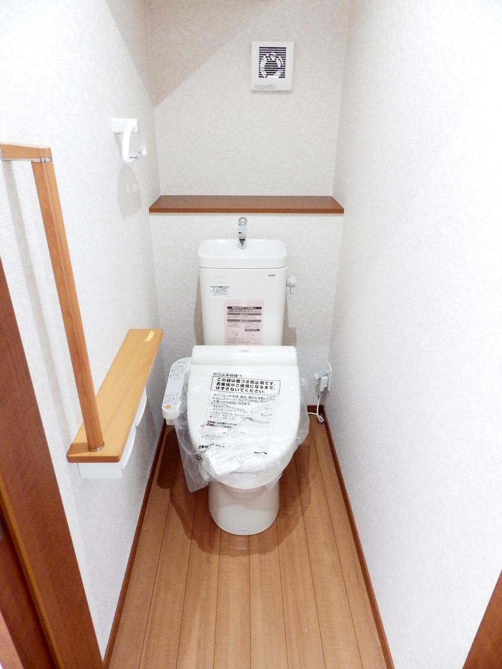 Toilet. It is a high-function toilet with a heated toilet seat.