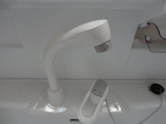 Wash basin, toilet. Wash basin is equipped with a convenient shower.