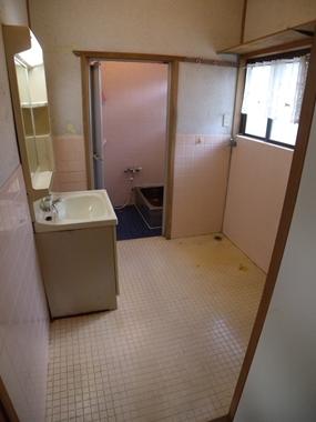 Wash basin, toilet. Furniture also put space that can hold those towels and clothing