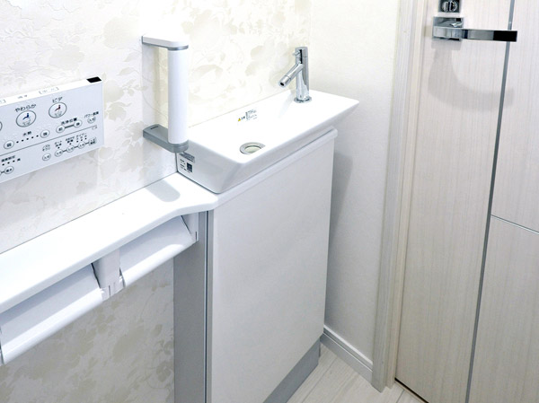 Toilet.  [Toilet counter] Installing a toilet counter to all households. In simple and stylish design, The lower part has become a storage cabinet.