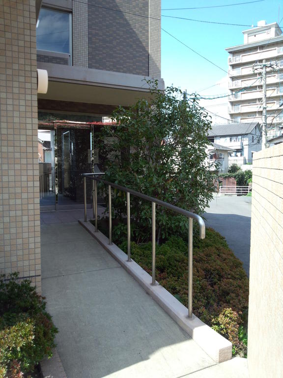 Building appearance. Apartment entrance is located in two places of the barrier-free and stairs