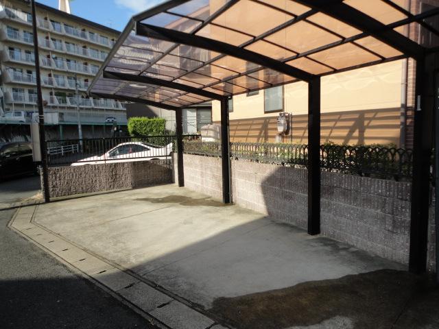 Parking lot. Two parked are car port