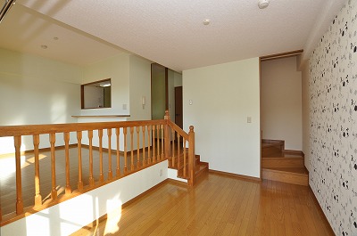Living and room. Stairs in the room! Hotel suites like