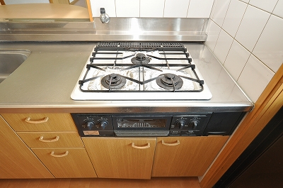 Kitchen. The kitchen is a three-necked with a gas stove with grill