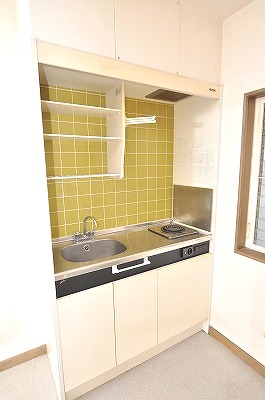 Kitchen. It is with an electric stove. 