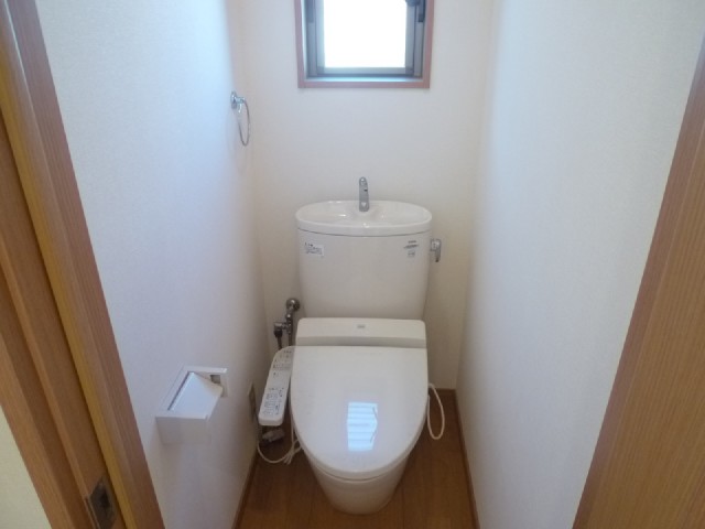 Toilet. There is a window in the toilet