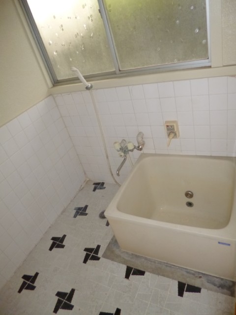 Bath. It is a bathroom with a window