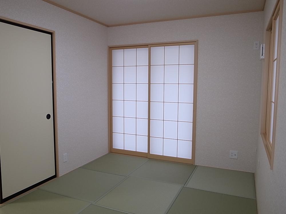 Model house photo. Japanese-style room is a modern atmosphere in the Ryukyu tatami